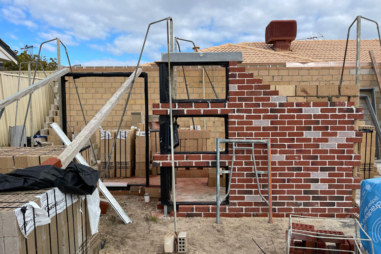 unit development in progress showing concrete slab and partial wall construction