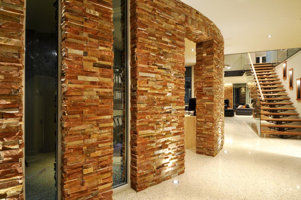 view of stacked flat stone feature wall in luxury hillarys home.